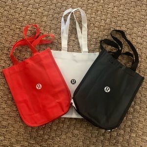set of 3 lululemon small tote bags (black, red, white)
